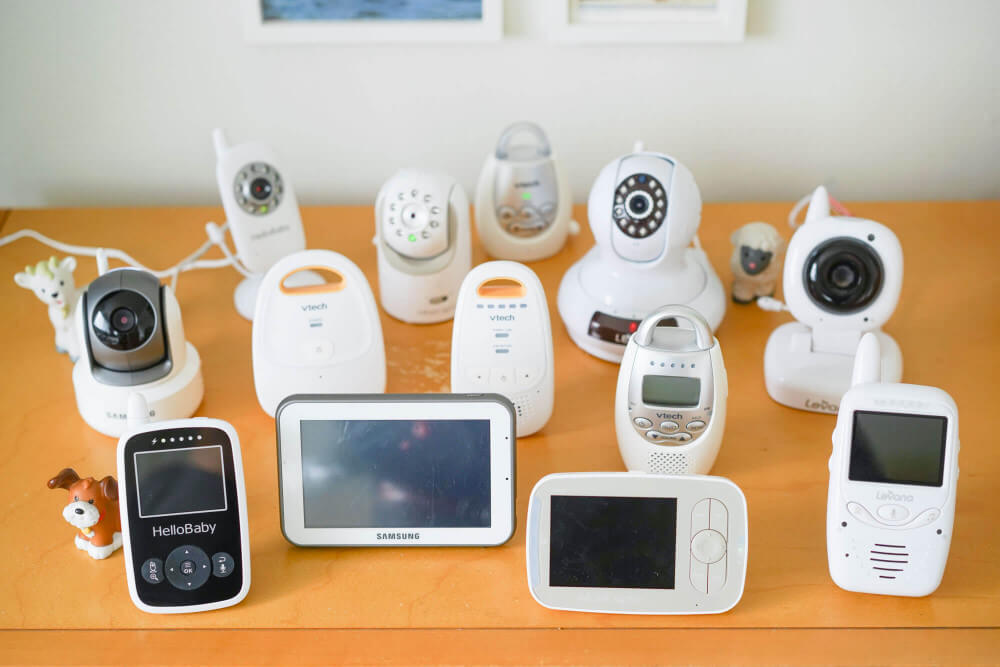 A group of baby monitors arranged for hands-on comparison