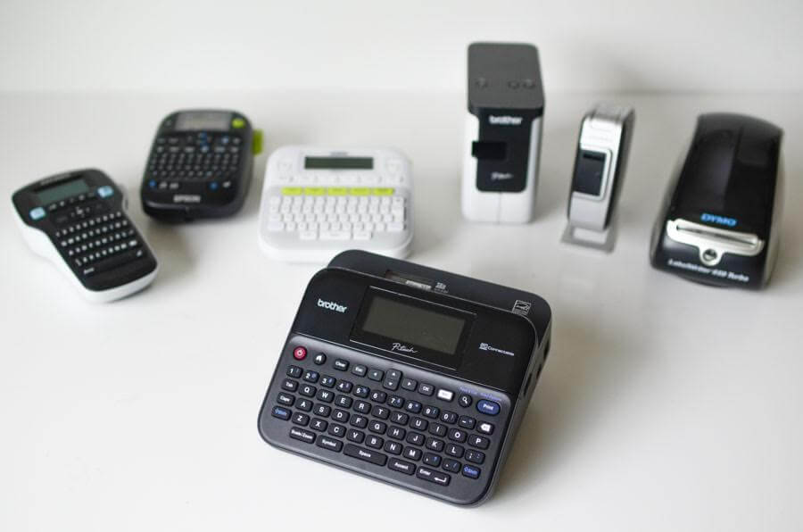 Label makers arranged on a white desk for comparison